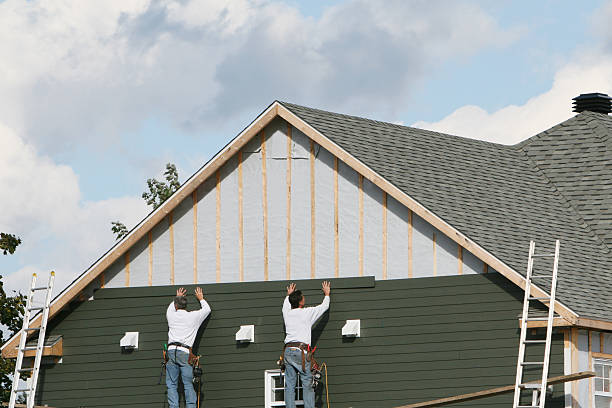 Professional Siding technician working in Churchton, MD